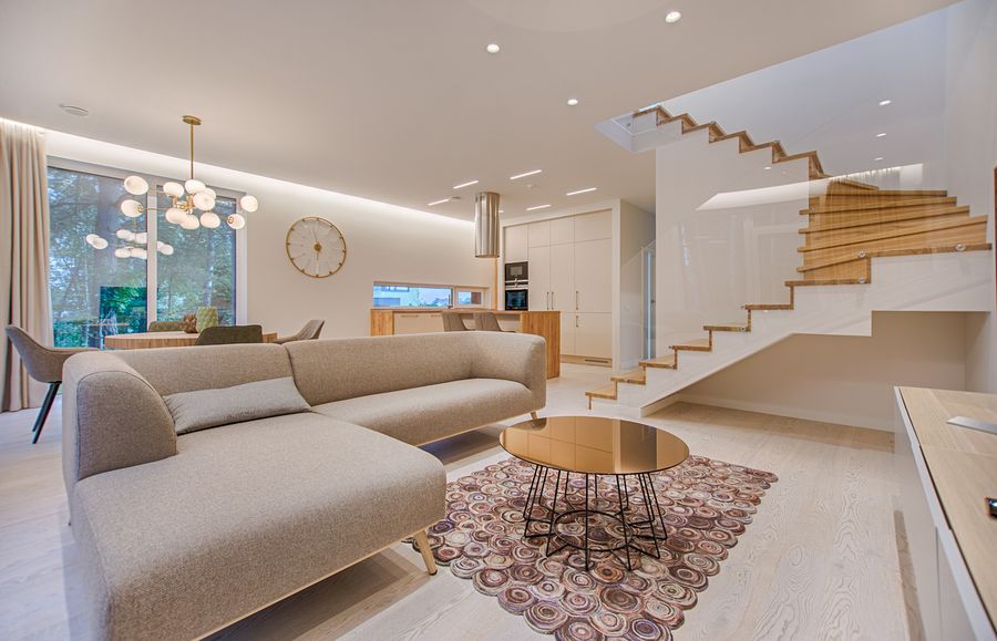 A bright, dry living room with clean hardwood floors after water damage restoration