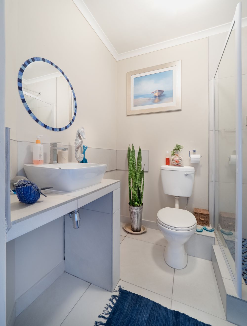 A home bathroom with a toilet, where a sewage backup usually shows up first